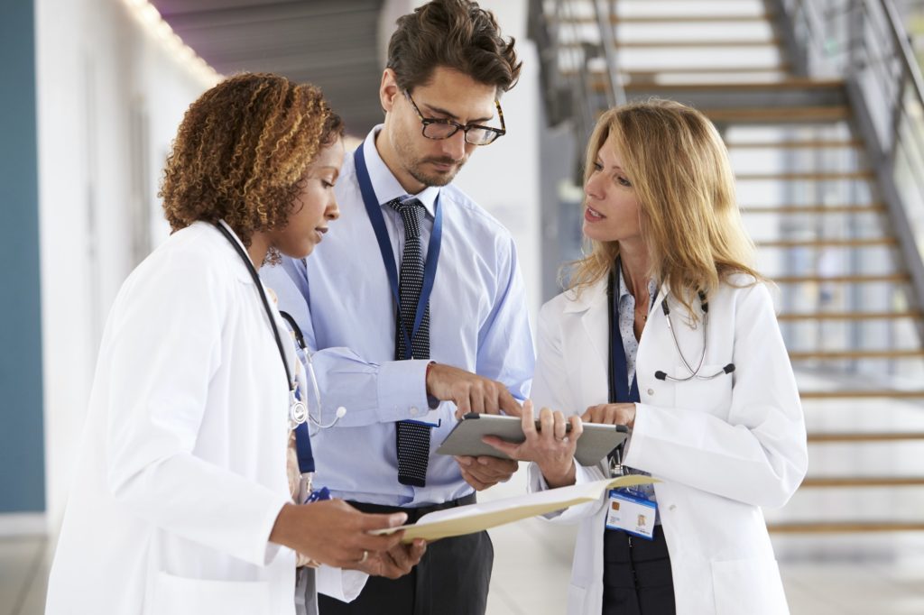 three-young-male-and-female-doctors-consulting-1024x682